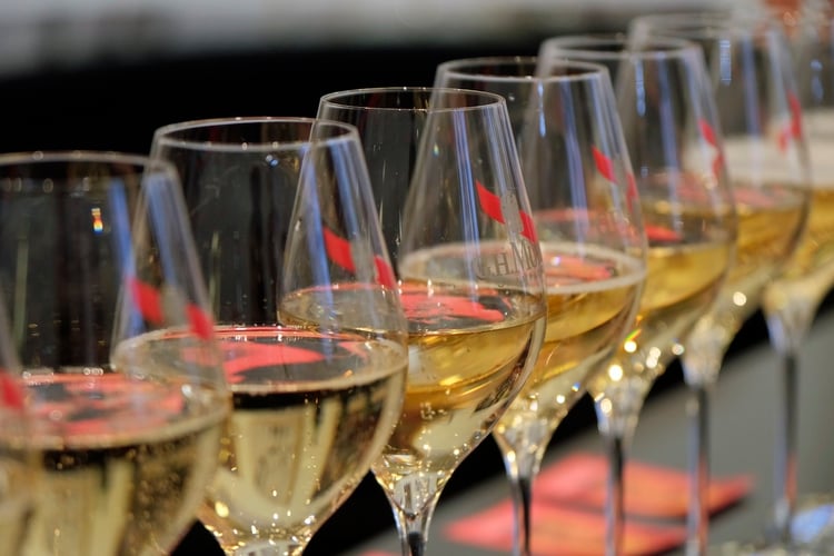 Row of Filled Champagne Flutes at GH Mumm in Reims, France