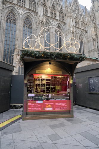 Vendor at Stephansplatz Christmas Market_Cathedral Backdrop_Vienna_2025