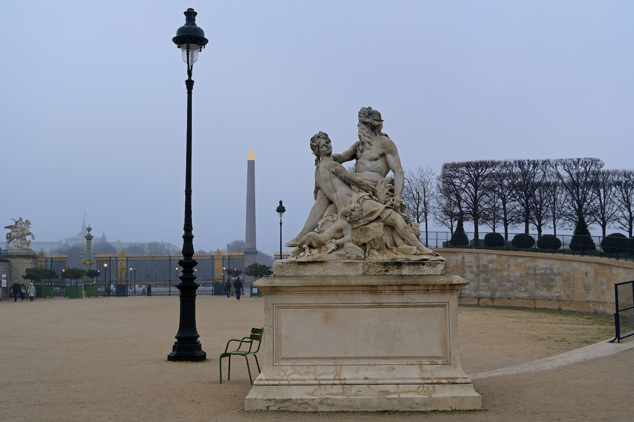 View from the Tuileries Garden towards Place de la Concorde in Paris, France during winter.